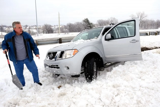Midwest Hammered By Major Snowstorm Car stuck in snow
