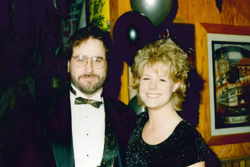 WKFR afternoon personality Dave Benson at Bourbon Street's New Year's celebration, with Bourbon Street staffer Gloria. (Dave Benson Photo Archive. Used by permission)